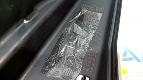 The underhood fuse box cover, left, for a Lexus ES300h 13-15, has a broken mount.