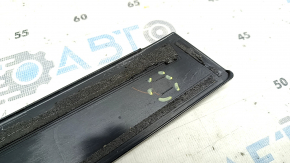 The front right side door trim for a Toyota Prius V 12-17 has broken fasteners.