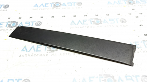 The rear right side door trim of a Toyota Prius V 12-17 has broken fasteners.