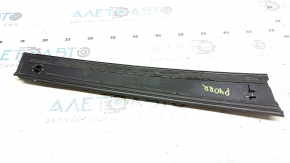 The rear right side door trim of a Toyota Prius V 12-17 has broken fasteners.