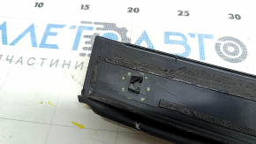 The rear right side door trim of a Toyota Prius V 12-17 has broken fasteners.