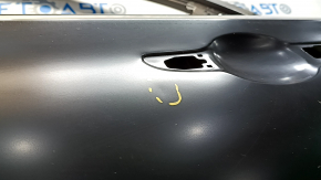 The rear left door of a Hyundai Sonata 15-19 is bare, with a small dent.