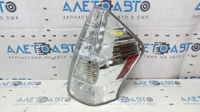 Right headlight of a 1992 Toyota Prius V, pre-restored, scratches, sand