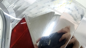 Right headlight of a 1992 Toyota Prius V, pre-restored, scratches, sand