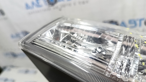 Right headlight of a 1992 Toyota Prius V, pre-restored, scratches, sand
