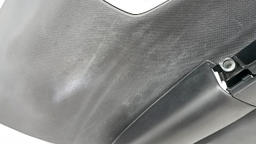Black rear left door panel for a 2021 Ford Bronco Sport with a handle, gray molding, black leather armrest, plastic insert, scratches, worn, whitened plastic