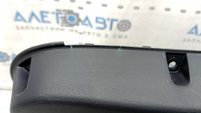 Black rear left door panel for a 2021 Ford Bronco Sport with a handle, gray molding, black leather armrest, plastic insert, scratches, worn, whitened plastic