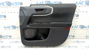 Black front right door panel for a 2021 Ford Bronco Sport with a handle, gray molding, black leather armrest, black cloth insert, whitened plastic, worn