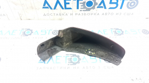 The front left mudguard of a Nissan Leaf 11-17 is worn and the fasteners are torn.