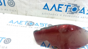 The front left mudguard of a Nissan Leaf 11-17 is worn and the fasteners are torn.
