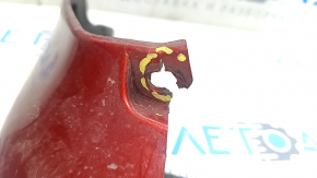 The front left mudguard of a Nissan Leaf 11-17 is worn and the fasteners are torn.