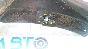 The front left mudguard of a Nissan Leaf 11-17 is worn and the fasteners are torn.
