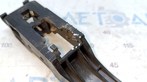 The front right door handle mechanism of a 17-22 Nissan Rogue Sport has a broken mount.