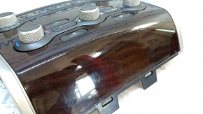 Climate control and audio controls for a 13-16 Nissan Pathfinder with navigation, wood grain, worn trim, broken mount