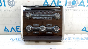 Climate control and audio controls for a 13-16 Nissan Pathfinder with navigation, wood grain trim, worn trim, broken mounts