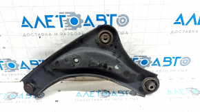 The lower front right control arm of a Nissan Leaf 11-17 has a torn silent block.