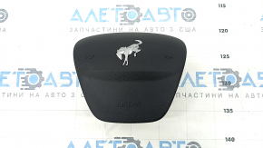The steering wheel airbag for the driver's side of the Ford Bronco Sport 2021-2025 is black and has a rusty squib.