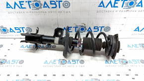 The front right shock absorber assembly for a Nissan Leaf 11-17 has a torn boot.