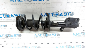 The front right shock absorber assembly for a Nissan Leaf 11-17 has a torn boot.