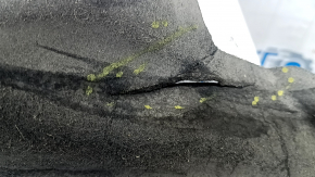 The right underbody protection of a 2021 Ford Bronco Sport is dented and torn.