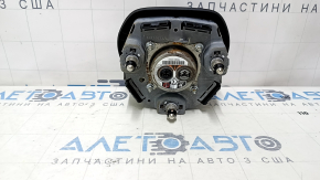 The Honda Accord 23-24 driver's steering wheel airbag is black and has a rusty squib.