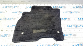 Front left Nissan Leaf 13-17 floor mat, black, torn emblem
