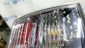 Left outer fender light for a Lexus RX450h 10-12 pre-restoration model, scratches