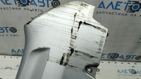 The front bumper lip of the Volvo XC90 16-19 is dented and scratched.