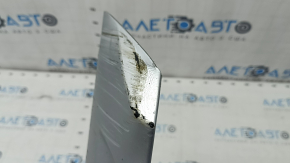 The front bumper lip of the Volvo XC90 16-19 is dented and scratched.