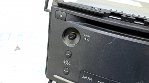 Lexus Hs250h radio has 10-12 scratches, missing buttons, and peeling chrome.