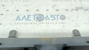 Bare front bumper for a Lexus RX450h 10-12 pre-restoration model, black, with cracks in the mountings