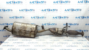 The exhaust pipe, middle section with a catalytic converter and heater, Lexus RX450h 10-15, is dented and rusty.