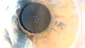 The exhaust pipe, middle section with a catalytic converter and heater, Lexus RX450h 10-15, is dented and rusty.