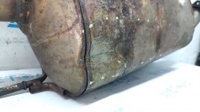 The exhaust pipe, middle section with a catalytic converter and heater, Lexus RX450h 10-15, is dented and rusty.