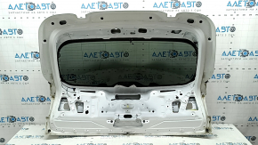 The trunk door is bare with glass, the upper part of the BMW X5 G05, 19-24 tinted, white 300, scratches on the glass