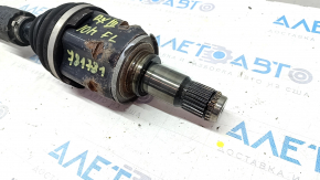 The front left half shaft of a Lexus RX450h 10-15 is rusty.