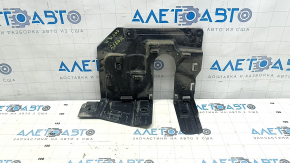 The left engine arch guard for a BMW X5 G05 19-24 is pinched and torn.
