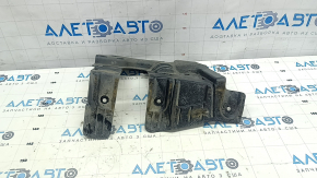 The left engine arch guard for a BMW X5 G05 19-24 is pinched and torn.