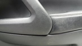 Black front right door panel for a 14-16 Nissan Rogue, leather armrest, dents, dents, and scratches