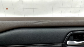 Front left door panel for Nissan Rogue 23-24 US built, black with black leather insert, leather armrest, brown top, with handle and trim, dented, scuffed