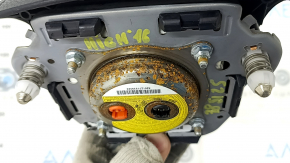 The driver's side airbag in the Toyota Highlander 14-19 is black and has a rusty squib.