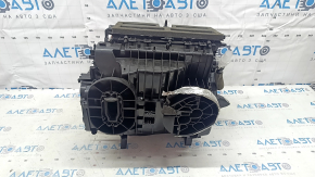 The heater housing is bare, left side of a 22-25 Nissan Rogue, us-built, without radiators.