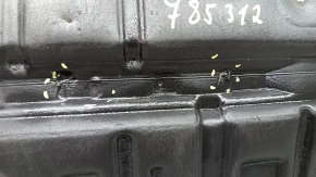 The left engine guard of a Toyota Avalon 13-15 is dented and torn.