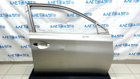 The front right door of a Toyota Avalon 13-18 beige 5B2 is bare and dented.