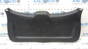 The trunk door trim of a 19-2019 Toyota Highlander is black, with plugs, scratches, and broken fasteners.