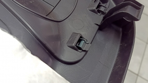 The trunk door trim of a 19-2019 Toyota Highlander is black, with plugs, scratches, and broken fasteners.