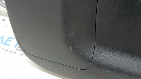 The trunk door trim of a 19-2019 Toyota Highlander is black, with plugs, scratches, and broken fasteners.