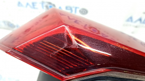 Nissan Rogue 17-20's left outer fender light is worn.