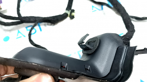 The front right door wiring of a Jeep Cherokee KL 19-19 is broken.