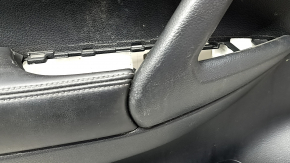 Front left door panel for Nissan Rogue 17-20, black with black plastic insert, leather armrest, graphite molding, dent, needs cleaning, worn